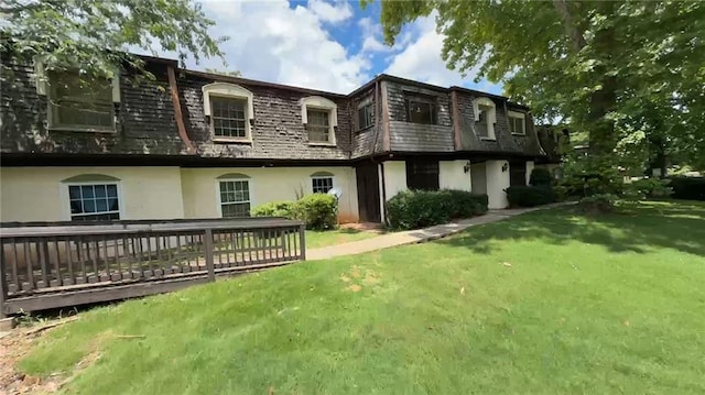 50 Le Parc Fontaine, Lithonia, GA 30038 - back of house featuring mansard roof, stucco siding, a lawn, and a wooden deck
