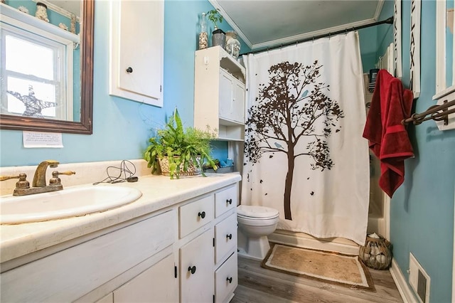 315 Charlotte Blvd, Stockbridge, GA 30281 - full bathroom featuring vanity, toilet, wood finished floors, and shower / bath combo