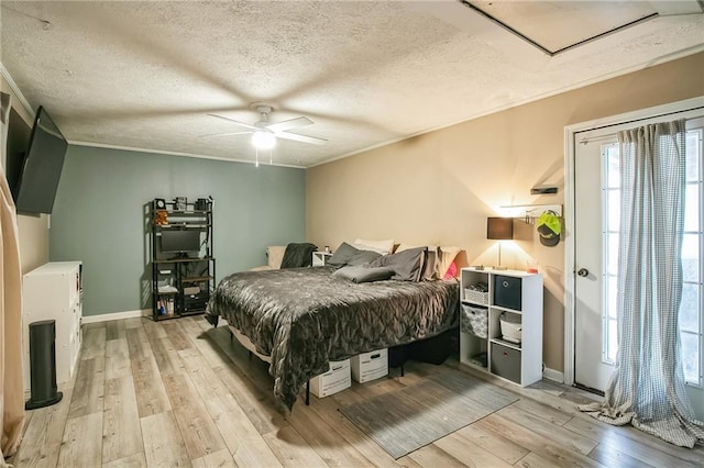 315 Charlotte Blvd, Stockbridge, GA 30281 - bedroom featuring light wood finished floors, crown molding, a textured ceiling, baseboards, and a ceiling fan