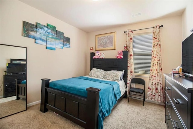 bedroom featuring light colored carpet