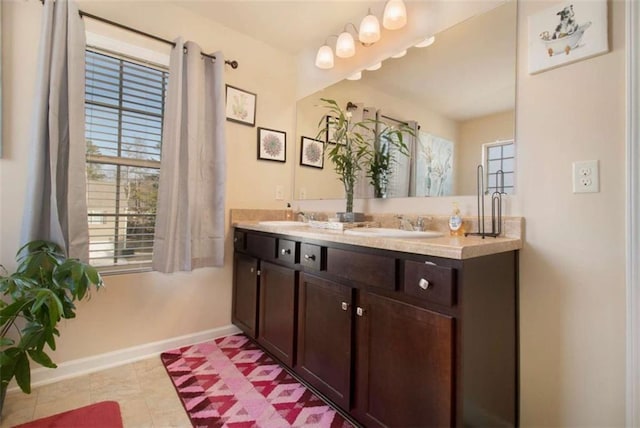 bathroom with tile patterned floors and vanity