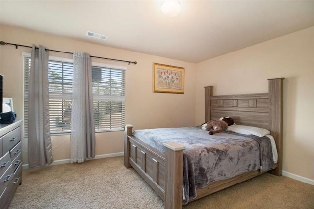 bedroom featuring light colored carpet