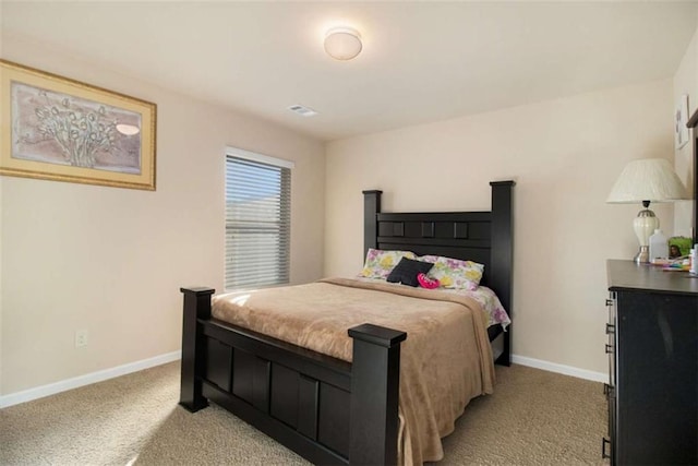 bedroom featuring light colored carpet