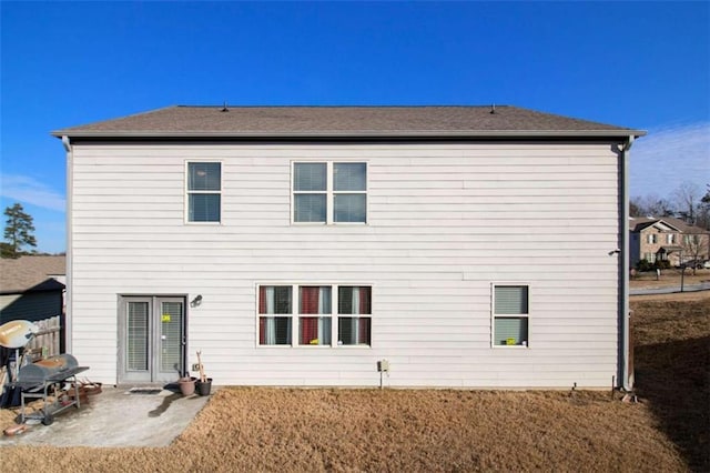 back of house featuring a yard and a patio