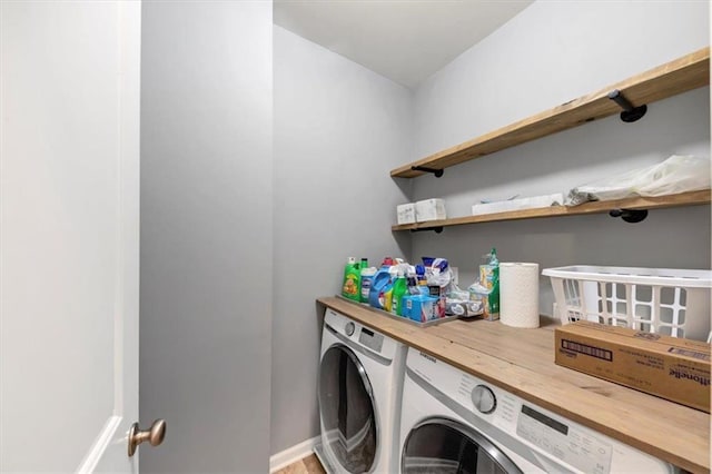 washroom with independent washer and dryer