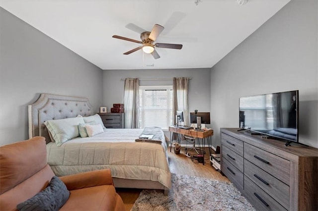 bedroom featuring light hardwood / wood-style floors and ceiling fan