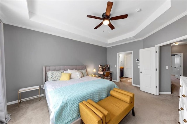 carpeted bedroom with a raised ceiling, ceiling fan, and ornamental molding