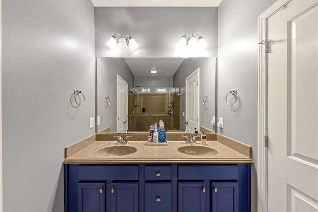 bathroom featuring vanity and a shower with shower door