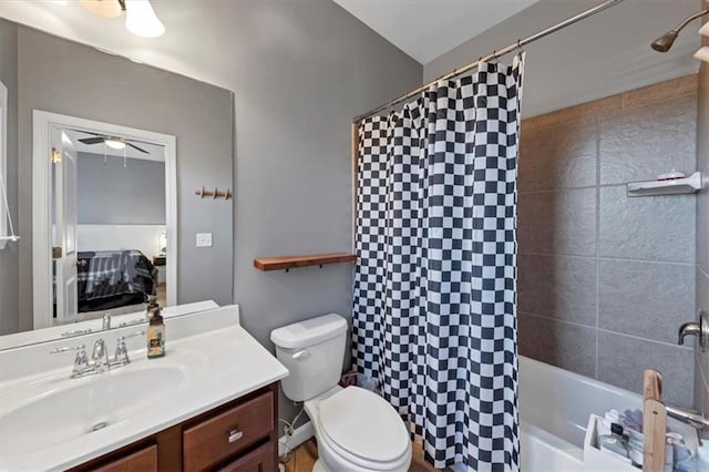 full bathroom featuring vanity, shower / bath combination with curtain, toilet, and ceiling fan