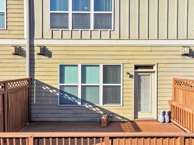 view of side of home with a deck