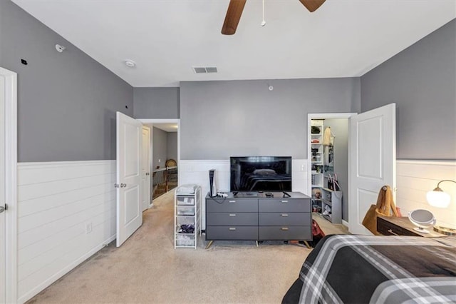 bedroom featuring ceiling fan and light colored carpet