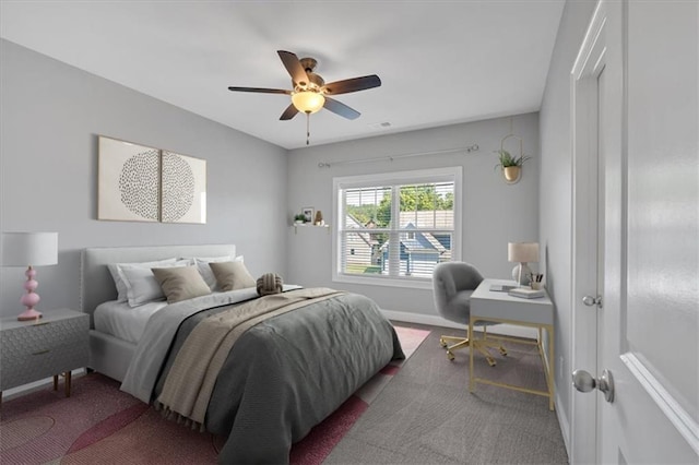 bedroom featuring carpet flooring, baseboards, a ceiling fan, and visible vents