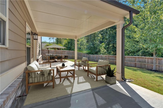 view of patio featuring outdoor lounge area and a fenced backyard
