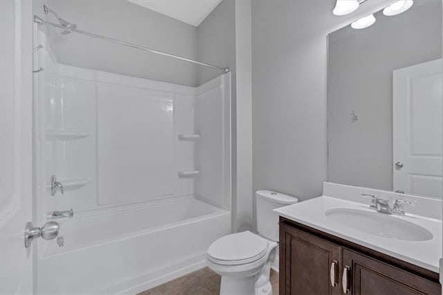 full bathroom featuring toilet, tile patterned floors, vanity, and shower / bath combination
