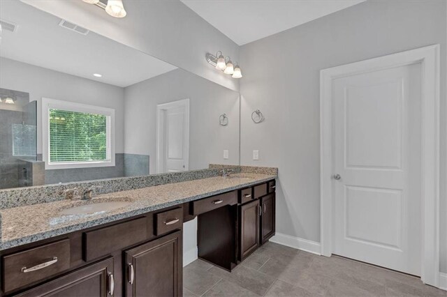 unfurnished room with visible vents, baseboards, carpet, and ceiling fan