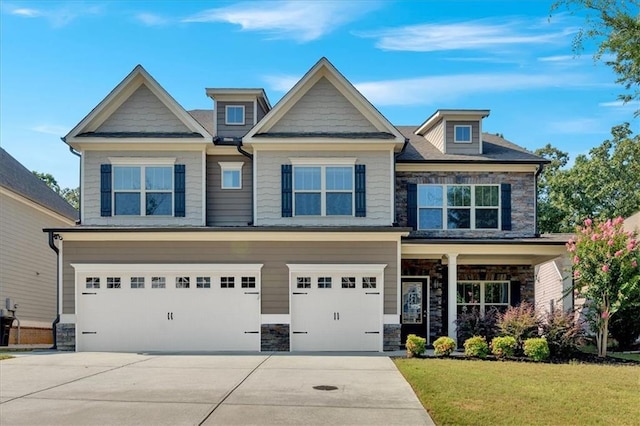 craftsman-style house featuring concrete driveway, a garage, and stone siding