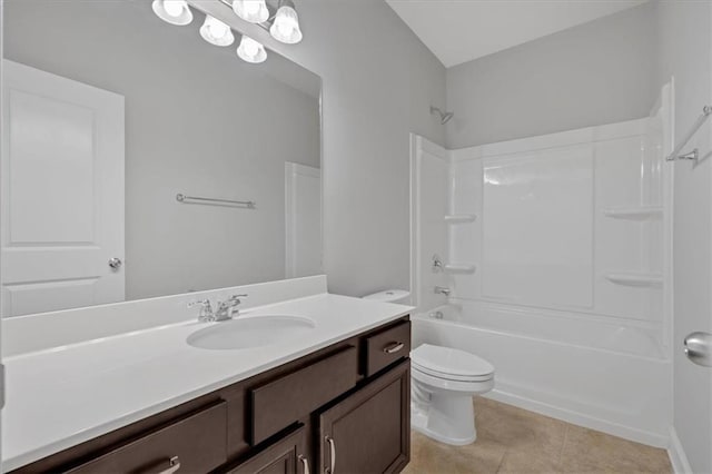 full bath with washtub / shower combination, tile patterned flooring, vanity, and toilet