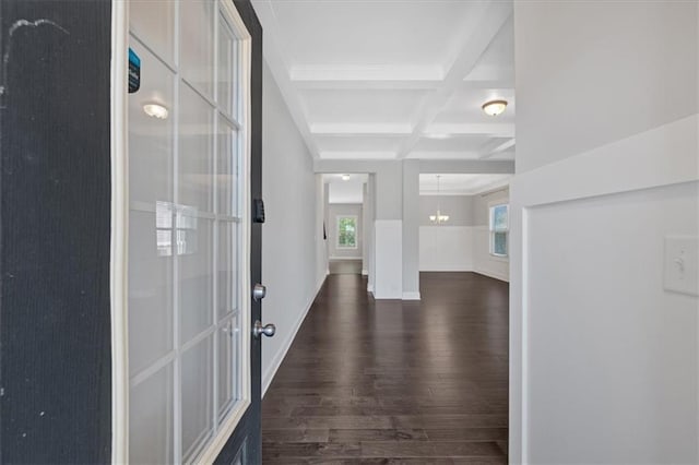 foyer with beamed ceiling, baseboards, coffered ceiling, and dark wood finished floors