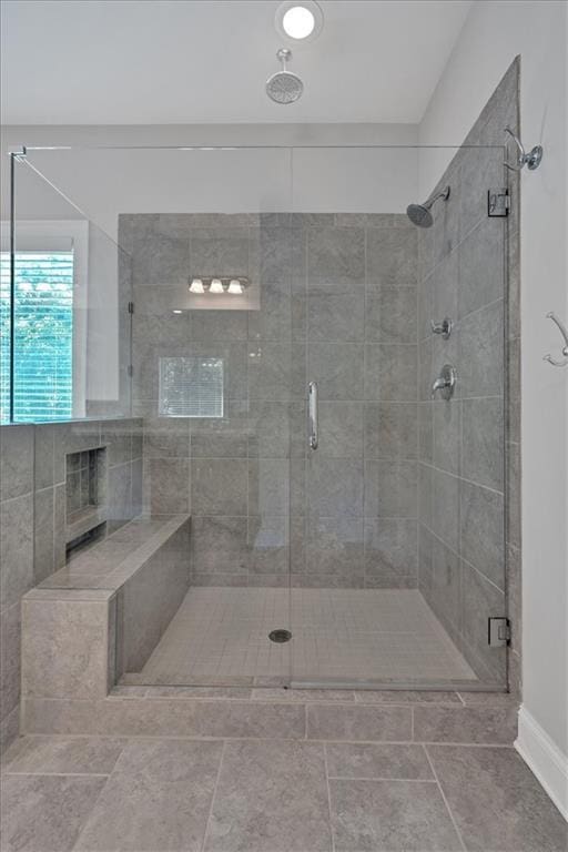 full bath featuring a shower stall