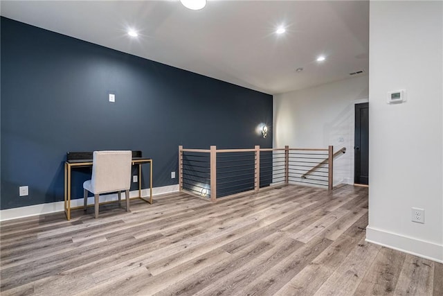 home office featuring wood finished floors, baseboards, visible vents, and recessed lighting