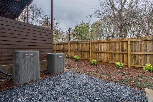 view of yard featuring cooling unit, a patio area, and fence