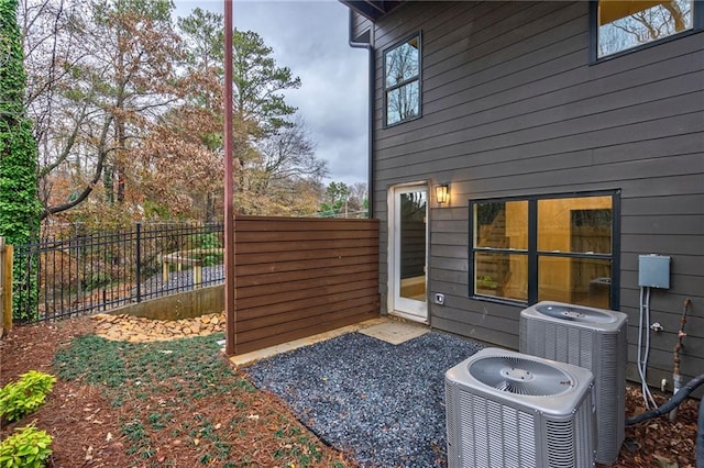 exterior space with a fenced backyard and cooling unit