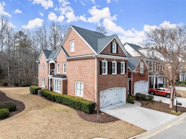 view of property exterior with brick siding, driveway, and an attached garage