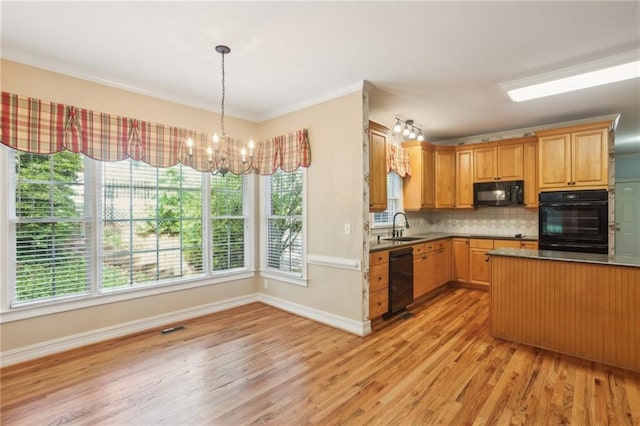 980 Ector Chase NW, Kennesaw, GA 30152 - kitchen featuring black appliances, light wood-style flooring, a chandelier, tasteful backsplash, and a sink