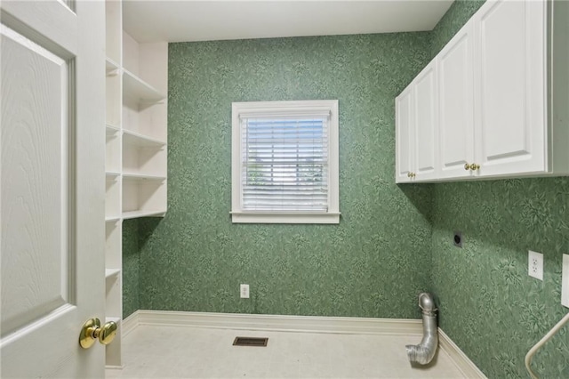 980 Ector Chase NW, Kennesaw, GA 30152 - laundry area featuring electric dryer hookup and cabinet space