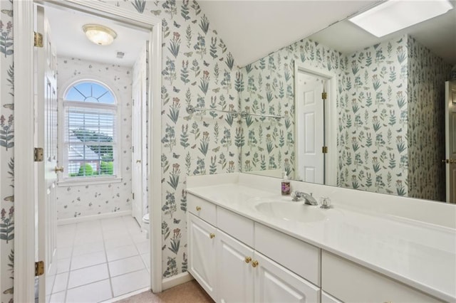 980 Ector Chase NW, Kennesaw, GA 30152 - bathroom featuring wallpapered walls, vanity, toilet, baseboards, and tile patterned flooring