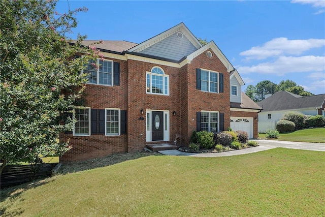 view of front of house featuring a front yard and a garage