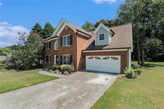 view of front of property with a garage and a front yard