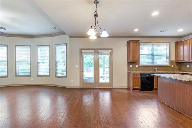 kitchen with visible vents, ornamental molding, dark wood-style floors, plenty of natural light, and dishwasher