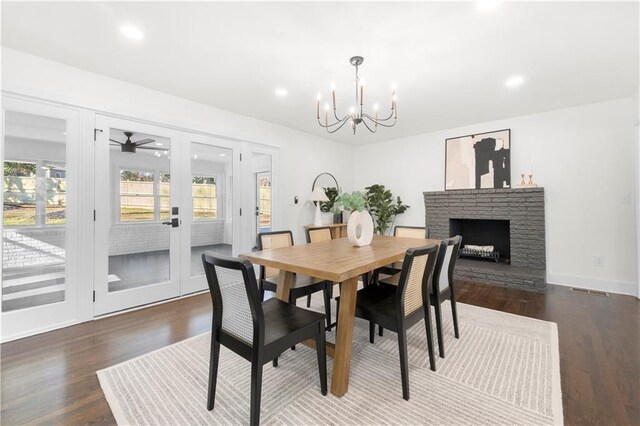 dining room with french doors, recessed lighting, a notable chandelier, and dark wood finished floors
