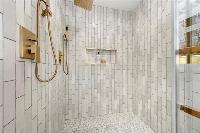 full bath featuring a tile shower