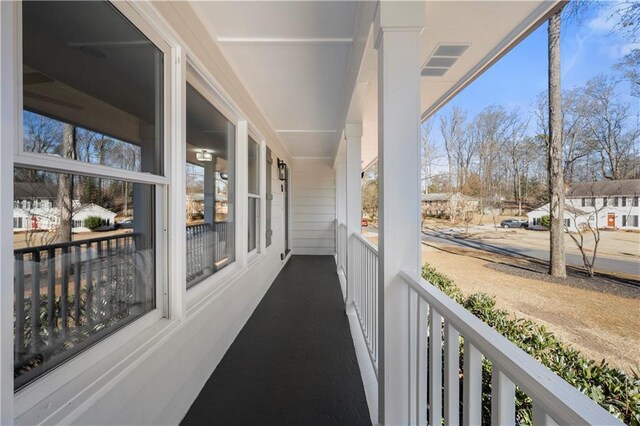 balcony featuring covered porch