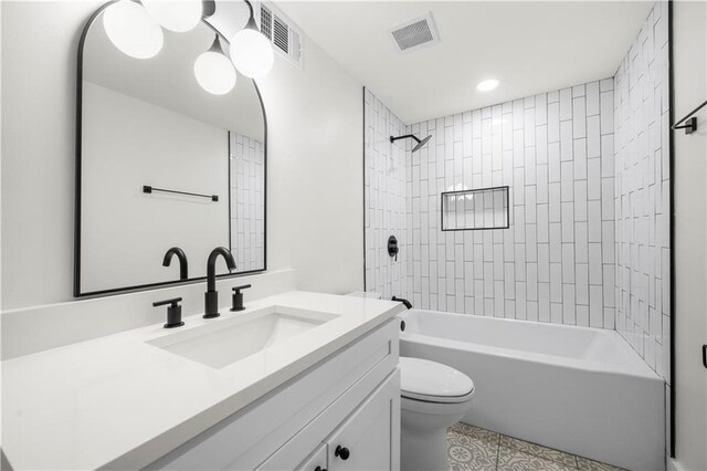 full bathroom featuring tub / shower combination, visible vents, toilet, and vanity