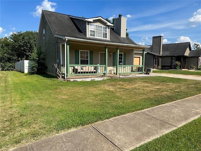 view of front of house featuring a front lawn, a porch, concrete driveway, a chimney, and an attached garage