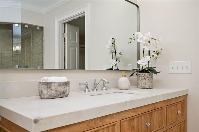 bathroom featuring ornamental molding and vanity