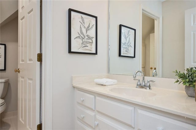 bathroom with toilet and vanity
