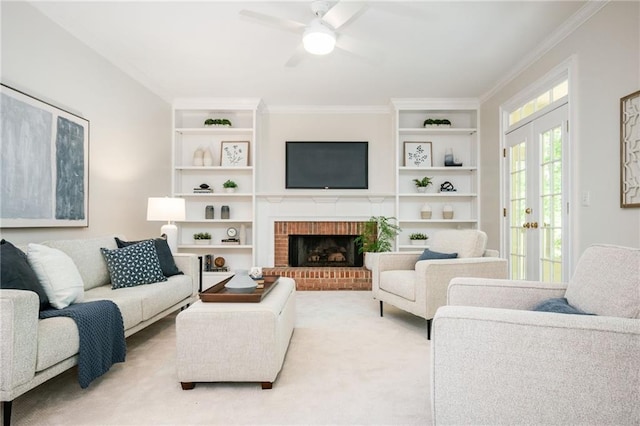 living area with crown molding, a ceiling fan, a brick fireplace, and light carpet