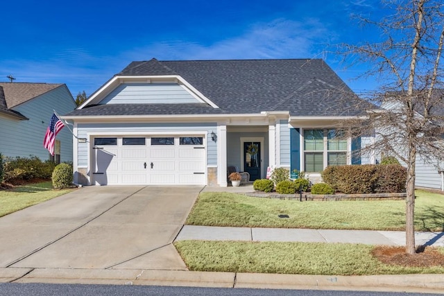 view of front facade featuring a garage and a front lawn