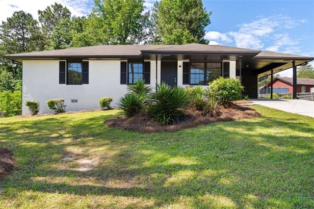 view of front of house featuring concrete driveway, an attached carport, a front yard, and crawl space