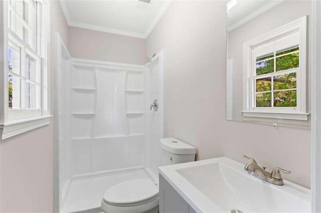 full bath featuring toilet, ornamental molding, a walk in shower, and vanity