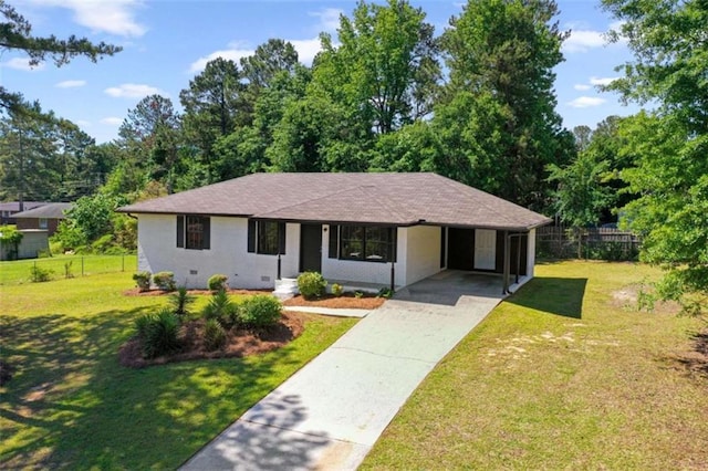 ranch-style house with driveway, an attached carport, and a shingled roof