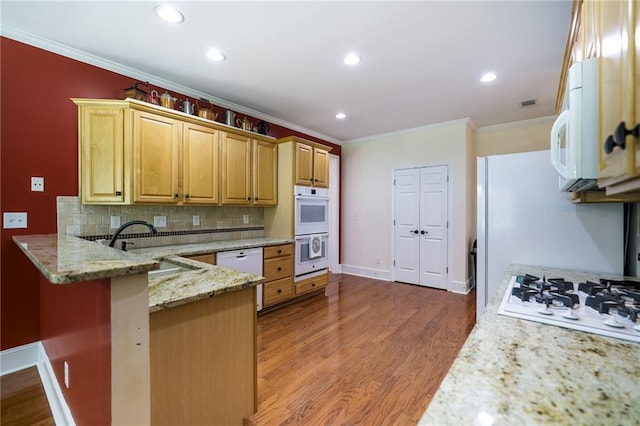 1997 Shaker Falls Ln, Lawrenceville, GA 30045 - kitchen featuring white appliances, crown molding, a sink, a peninsula, and dark wood finished floors