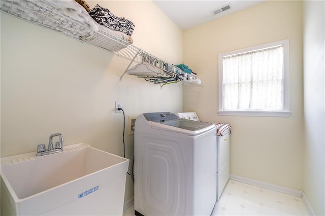 1997 Shaker Falls Ln, Lawrenceville, GA 30045 - laundry area with washer and clothes dryer, baseboards, and light flooring