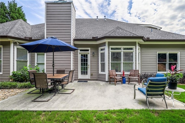 1997 Shaker Falls Ln, Lawrenceville, GA 30045 - rear view of house featuring a patio area, a chimney, and a shingled roof