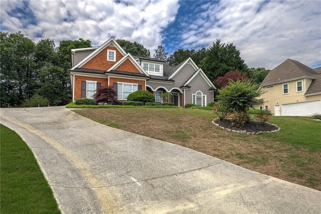 1997 Shaker Falls Ln, Lawrenceville, GA 30045 - craftsman-style home with a front yard and driveway