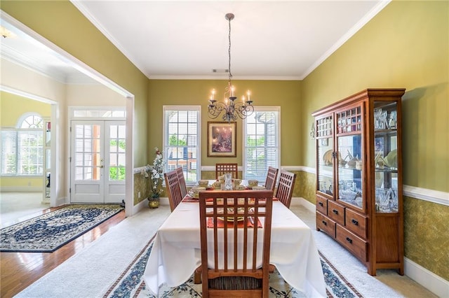 1997 Shaker Falls Ln, Lawrenceville, GA 30045 - dining area with a chandelier, crown molding, baseboards, and light wood-style flooring